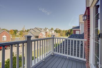 the deck of a home with a view of the neighborhood